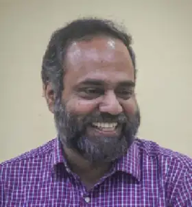Dr. Saji K Mathew